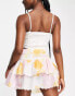 Фото #2 товара ASOS DESIGN tiered button front mini skirt with scalloped hem in washed floral