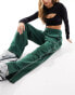 Фото #4 товара Nike Streetwear oversized fleece wide leg jogger in dark green