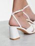 Glamorous mid heel sandals with bow in white