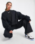 Nike mini swoosh extra oversized crop sweatshirt in black and sail