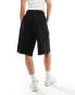 COLLUSION extreme longline short in black