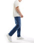 Фото #4 товара Tommy Jeans regular tapered dad jeans in mid wash