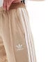 adidas Originals Adicolour flare tracksuit bottoms in beige