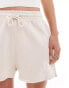 Фото #4 товара ASOS DESIGN unisex shorter length slim shorts in washed beige