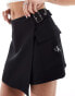 Calvin Klein Jeans buckle wrap mini skort in black