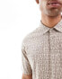 Armani Exchange polo with tonal all over lettering print in beige