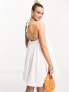 The Frolic Maternity sunstone halter volume mini summer dress in white waffle