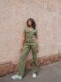 Фото #1 товара Labelrail x Pose and Repeat belted boiler suit in forest green with pink contrast stitch