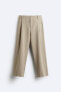 Wide-fit pleated trousers