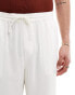 ASOS DESIGN relaxed linen trousers in white with embroided hem