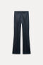 FLARE-LEG DENIM-LOOK TROUSERS