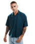 ASOS DESIGN oversized boxy polo shirt in green pinstripe