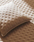 Quilted dotted cushion cover