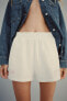 PLUSH SHORTS WITH SLOGAN