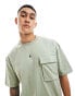 Фото #1 товара ASOS DESIGN oversized t-shirt with front pocket in washed green