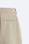 Wide-fit pleated trousers