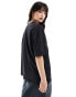 ASOS DESIGN oversized t-shirt with surf shack graphic in washed charcoal