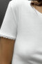 T-SHIRT WITH FAUX PEARLS SLEEVES