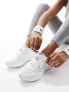 Nike Running Interact Run trainers in white and silver