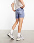 ASOS DESIGN shorter length denim shorts in midwash with rip detail and raw hem