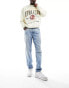 Фото #1 товара ASOS DESIGN tapered jeans in mid wash blue