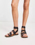 ASOS DESIGN Foxy leather studded toe loop flat sandals in black