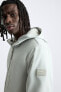 Hooded technical jacket