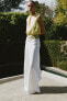 Wide-leg mid-rise trousers