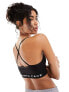 The North Face Training seamless performance sports bra in black Exclusive at ASOS