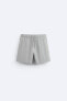 Check-texture swimming trunks