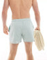 ASOS DESIGN swim shorts in short length in pale blue