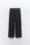 Trousers with satin waistband