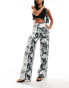 ASOS DESIGN wide leg satin twill trousers in distorted animal print