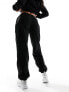 The Couture Club teddy fleece joggers in black