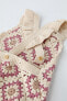 Knit crochet romper with flower detail