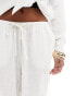 ASOS DESIGN Petite wide leg pull on trouser with linen in white