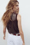 Sleeveless sequinned knit top