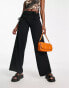 Neon & Nylon low waisted trousers with cut out detail in black