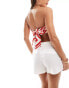 Фото #4 товара ASOS DESIGN stretch satin scarf hem bandeau top with tie back in red and white