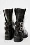 Leather ankle boots with buckled gaiters