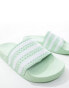 adidas Originals Adilette sliders in lime green