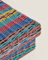 Multicoloured plaited basket lid