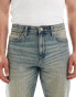 ASOS DESIGN tapered fit jeans in mid wash blue with tint