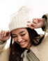 River Island cable knit pom beanie in cream