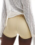 ASOS DESIGN disco micro shorts in gold