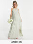 Фото #2 товара TFNC Maternity Bridesmaid strappy back halter neck dress in sage green