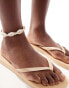 Accessorize flip flop in gold