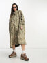 Noisy May Droplets longline rain poncho in camel zebra print