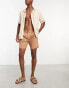 ASOS DESIGN pleated shorts in mid length in tan