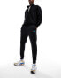 Nike Club patch logo joggers in black